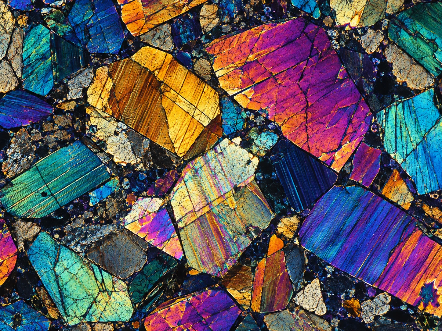 Polarized light inspired illustration of colorful interlocking mineral grains